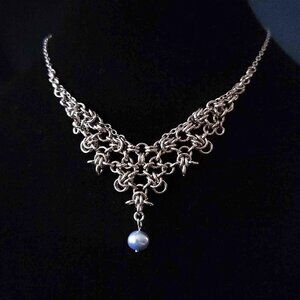Vintage silver princess necklace with a blue pearl